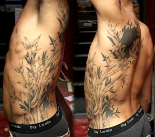 Grey Ink Bamboo Tree Tattoo On Left Side Rib